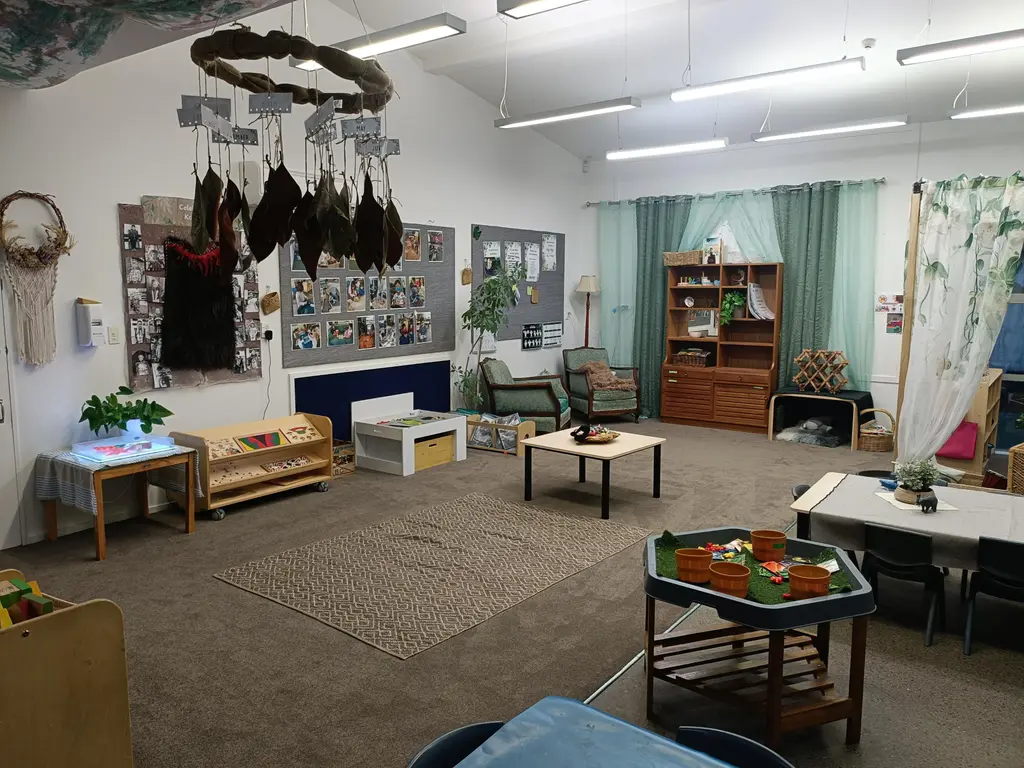 Harmony Haven indoor learning room with soft seating, books, and children's artwork