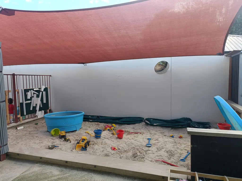Harmony Haven outdoor area with sandpit and natural play spaces